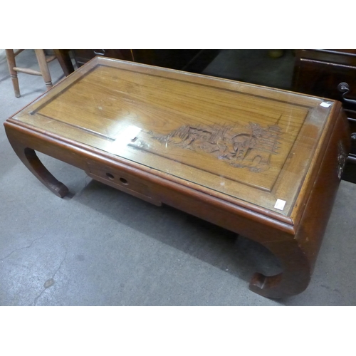 154 - A Chinese carved hardwood opium table