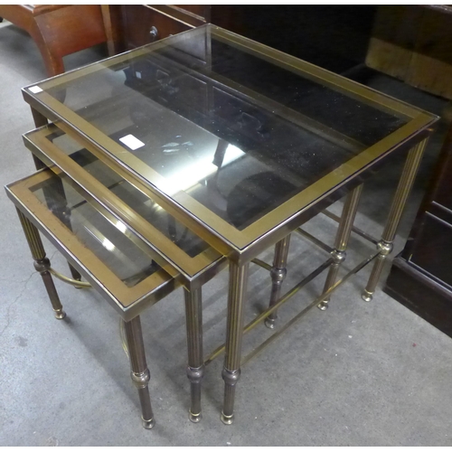 156 - An Italian brass and glass topped nest of tables