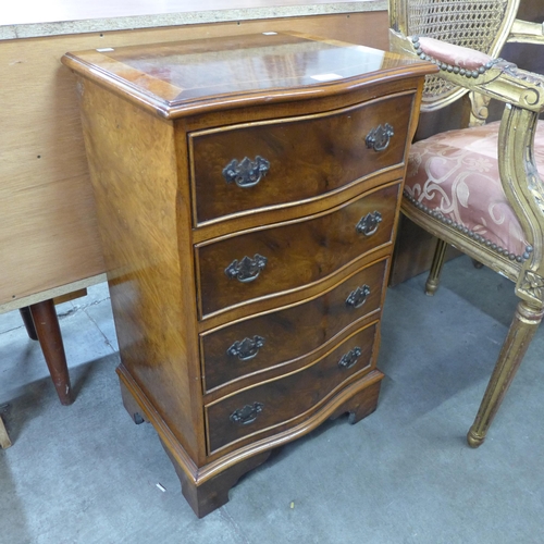 170 - A small George III style inlaid walnut chest of drawers