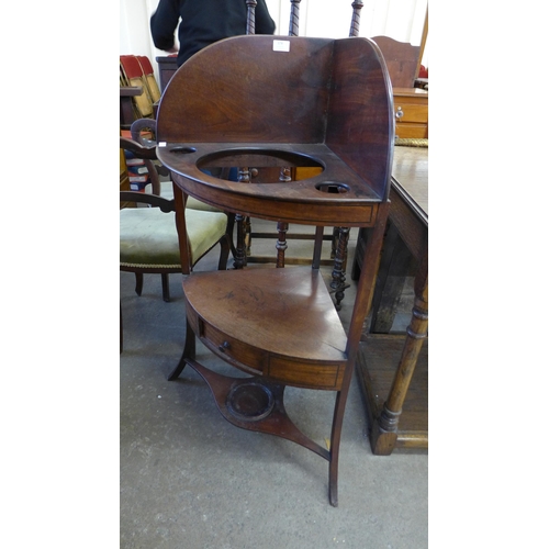 174 - A George III mahogany corner washstand