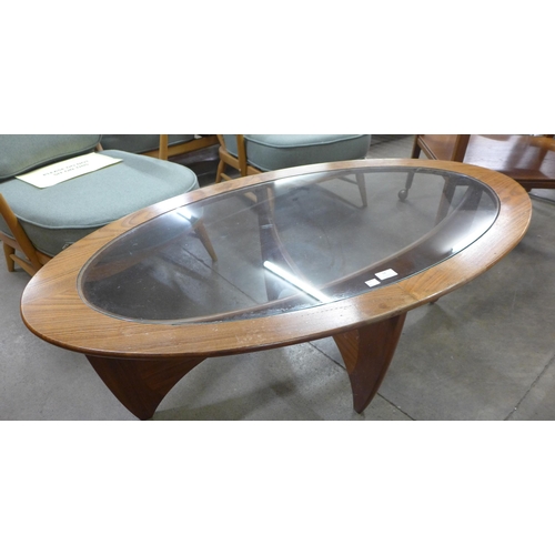 18 - A G-Plan Astro teak and glass topped oval coffee table