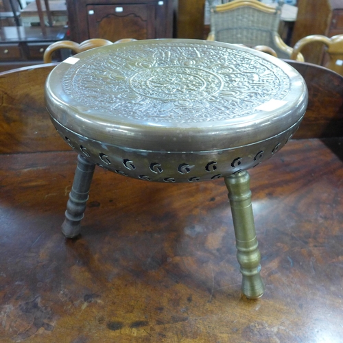 190 - An Islamic brass tripod stool