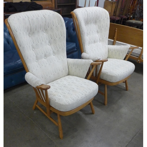 21 - A pair of Ercol Blonde beech Evergreen armchairs