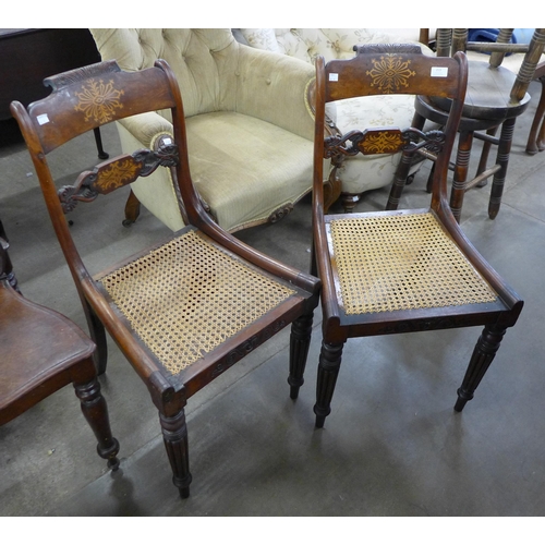 213 - A pair of Regency inlaid mahogany and bergere seated side chairs