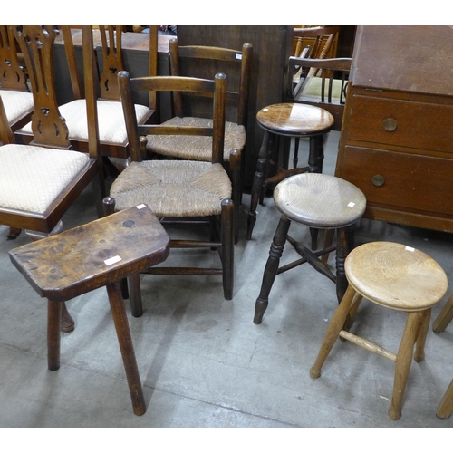 218 - Three Victorian elm stools, another stool and a pair of beech rush seated chairs