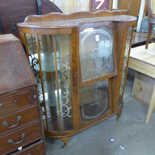 233 - A walnut two door display cabinet