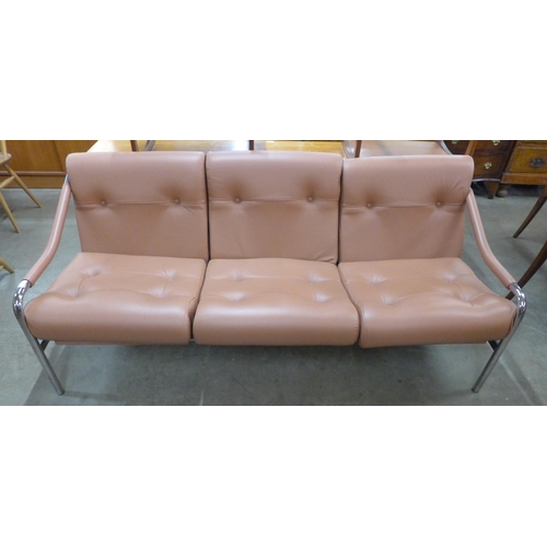 24 - A Pieff chrome and tan leather settee