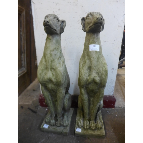 311 - A pair of concrete garden figures of seated greyhound