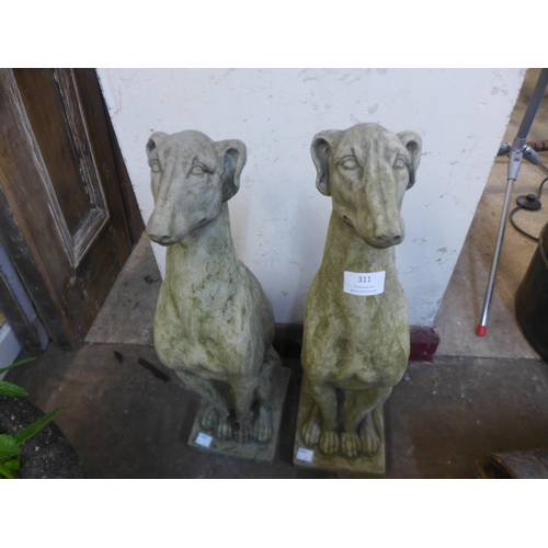 311 - A pair of concrete garden figures of seated greyhound