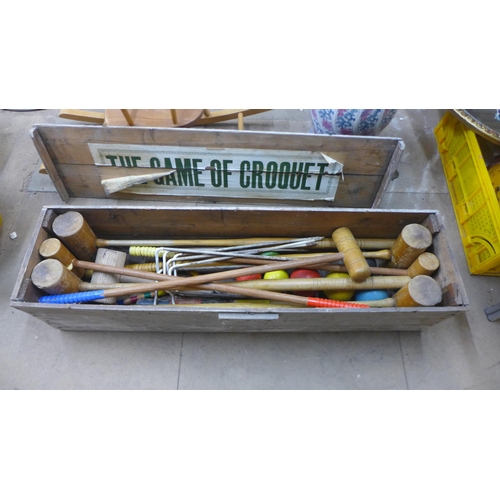 321 - A vintage cased lawn croquet set