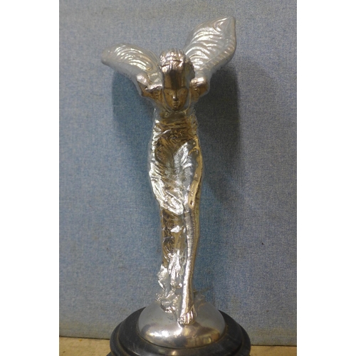 322 - A large chrome effect Spirit of Ecstasy, on black marble socle