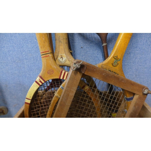 324 - A set of Avery baby weighing scales and a wooden crate with vintage tennis and badminton rackets