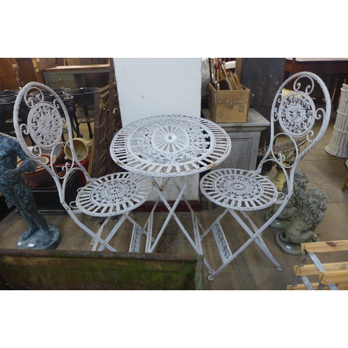 325 - A French style metal folding garden table and two chairs