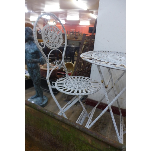 325 - A French style metal folding garden table and two chairs