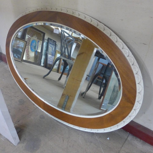 360 - An Edward VII painted walnut ovel framed mirror