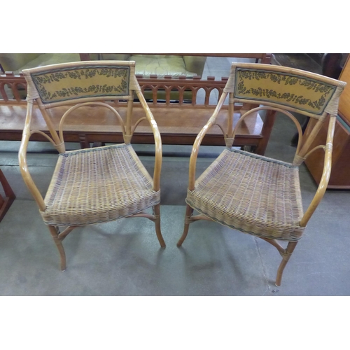 37 - A pair of Italian bamboo and rattan elbow chairs
