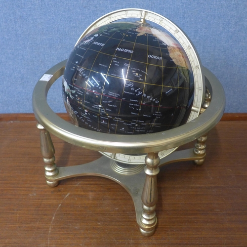 374 - A desk top faux gem set terrestrial globe on gilt stand