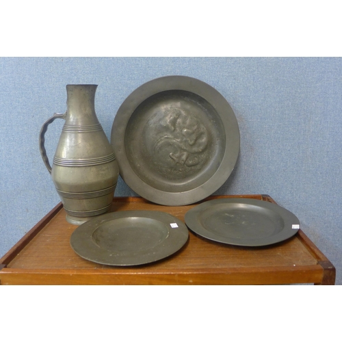 378 - A large pewter ewer and three plates