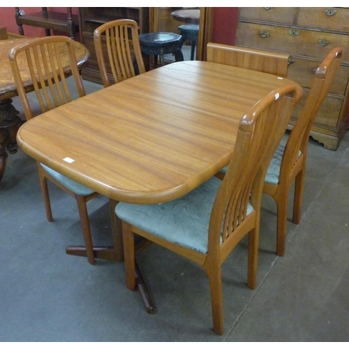 38 - A Danish Ansagar Mobler teak extending dining table and four chairs