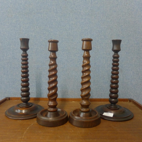 380 - A pair of oak bobbin turned candlesticks, labelled; Made from timber taken from HMS Britannia and tw... 