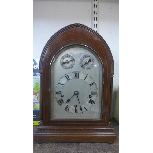 391 - An early 20th Century German Winterhalder & Hofmeier inlaid mahogany bracket clock, chiming on coil ... 