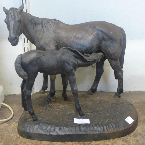 428 - A cast iron figure of a horse and foal