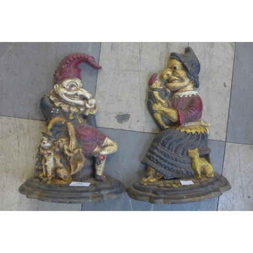 430 - A pair of painted cast iron Punch and Judy door stops