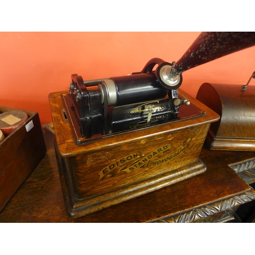 432 - An oak cased Edison Standard Phonograph, with metal speaker horn and various wax cylinders