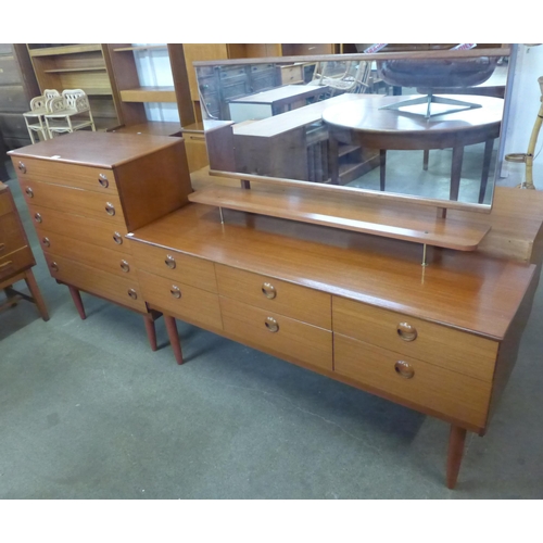50 - A teak chest of drawers and dressing table