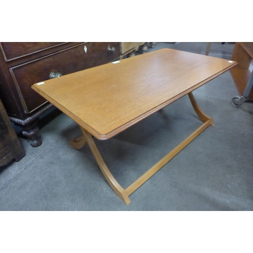 57 - A teak folding coffee table