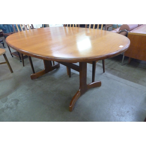 64 - A G-Plan Fresco teak extending dining table and six chairs