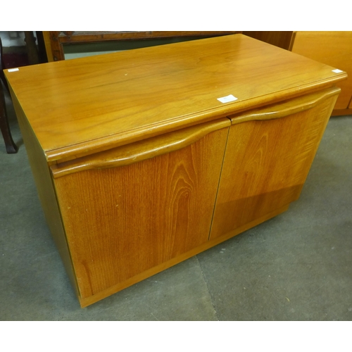 86 - A small teak two door cabinet