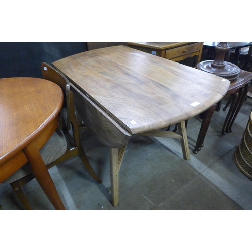 89 - An Ercol elm and beech drop-leaf table