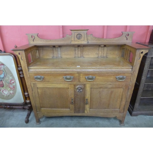 97 - An Arts and Crafts oak dresser