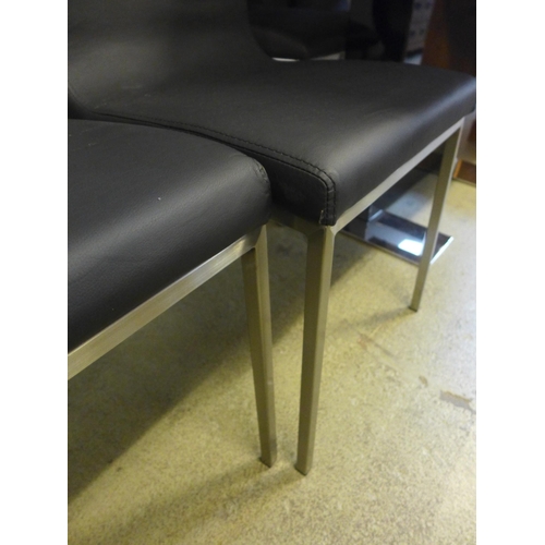 1613 - A pair of black and chrome leather effect dining chairs