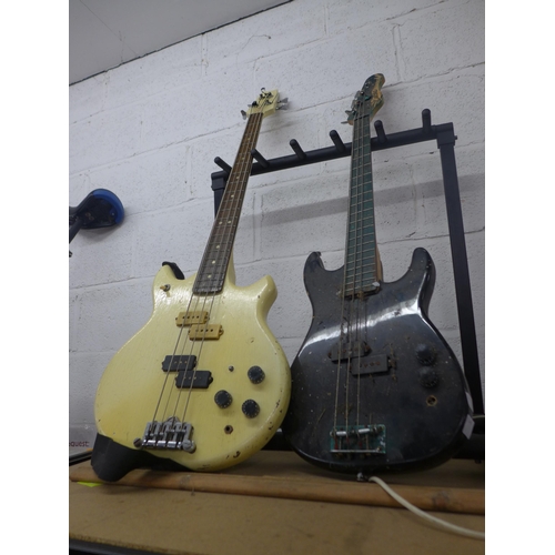 2144 - Two electric bass guitars