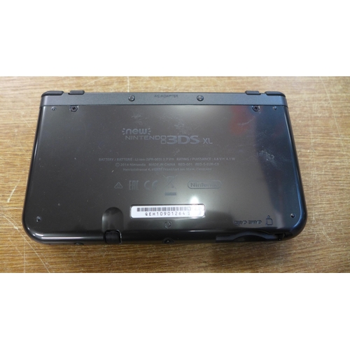 2157 - A Nintendo 3DS XL with charger