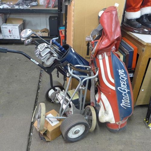 2198 - A Powakaddy Classic golf trolley and two golf bags with approx. 25 clubs