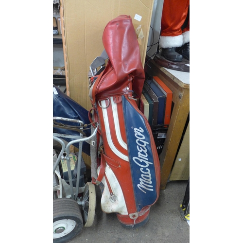 2198 - A Powakaddy Classic golf trolley and two golf bags with approx. 25 clubs