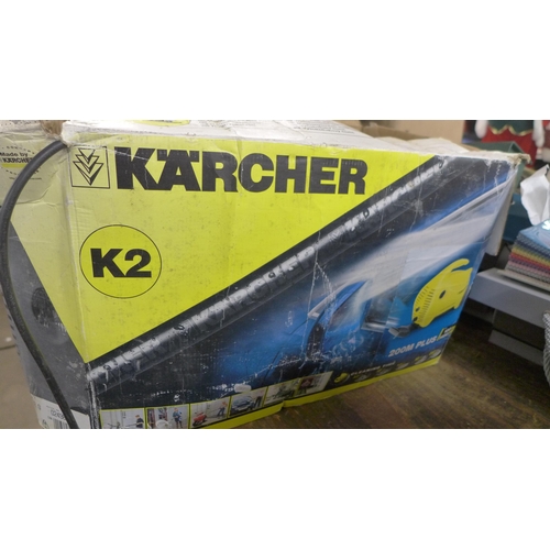 2457 - A Karcher K2 jet wash with attachments - W