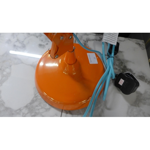 1445 - An orange anglepoise lamp