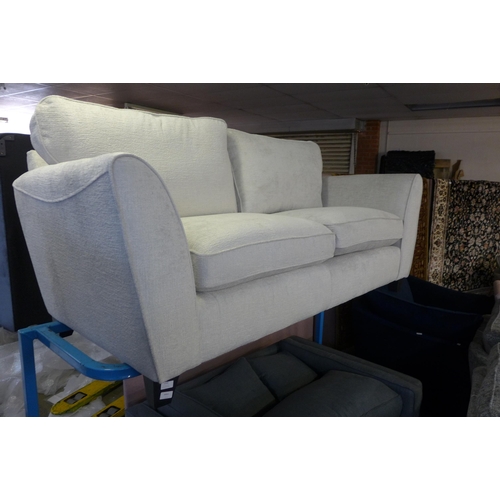 1549 - A Barker & Stonehouse cream upholstered three seater sofa