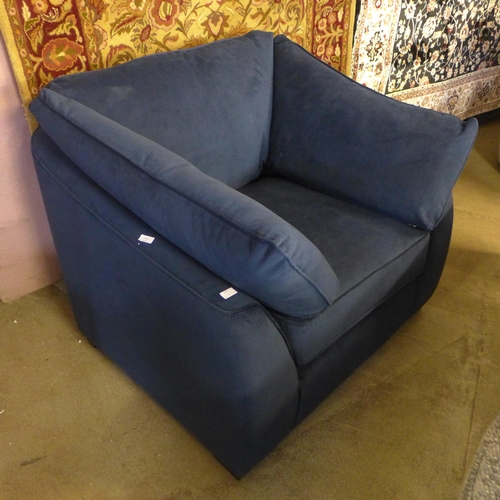 1551 - A Barker & Stonehouse navy velvet armchair