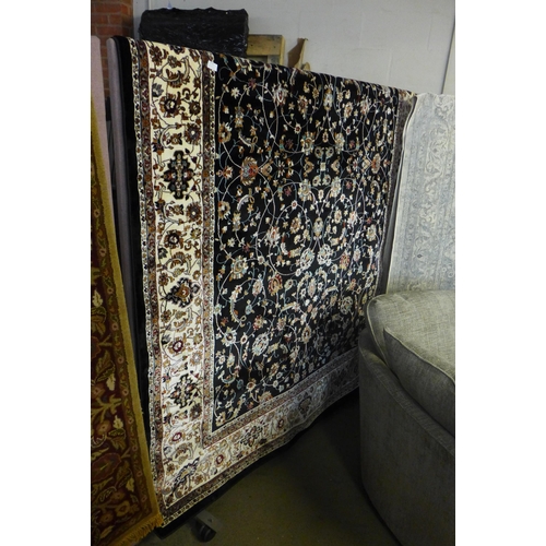 1553 - A black ground fine woven Iranian carpet with all over floral pattern