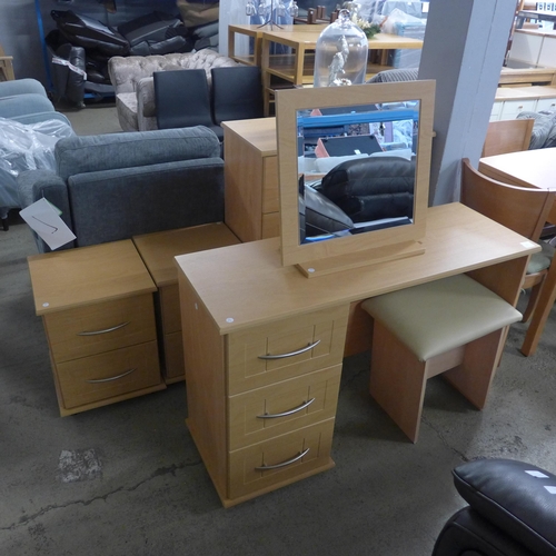 1582 - A beech effect dressing table, mirror, stool chest of drawers and a pair of bedside chairs