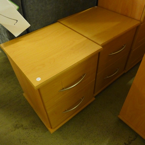 1582 - A beech effect dressing table, mirror, stool chest of drawers and a pair of bedside chairs