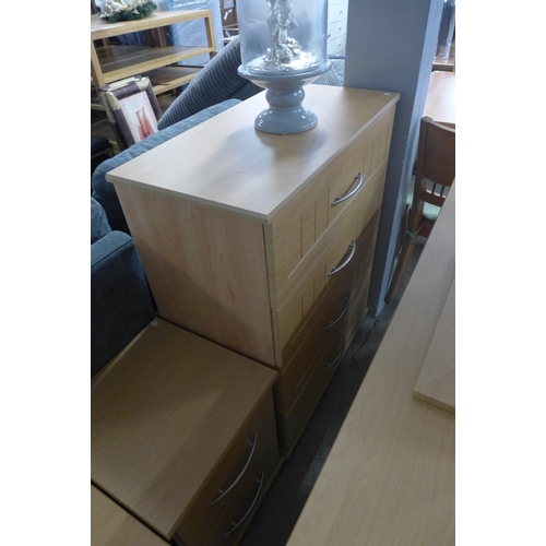 1582 - A beech effect dressing table, mirror, stool chest of drawers and a pair of bedside chairs