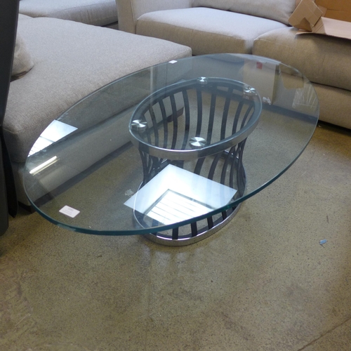 1591 - A glass topped oval coffee table with metal base