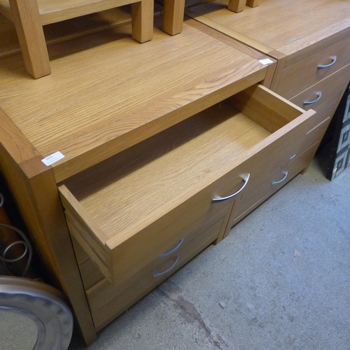 1656 - An oak five drawer chest * this lot is subject to VAT