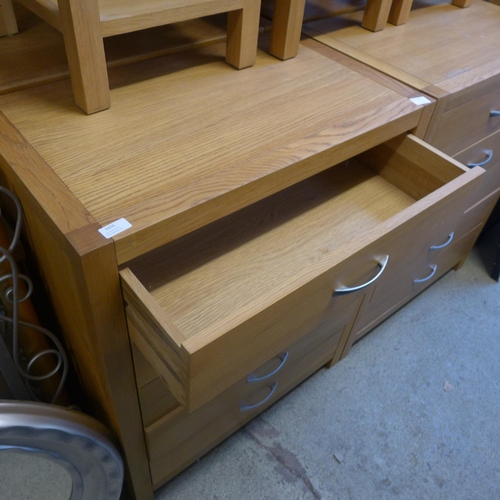 1657 - An oak five drawer chest * this lot is subject to VAT